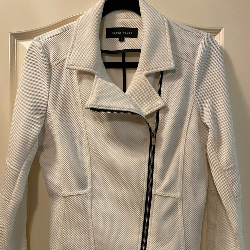Black Rivet white coat
